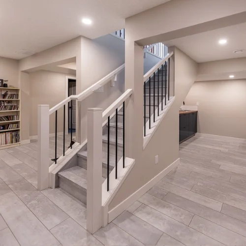 Finished residential interior with tile flooring and new stair railing